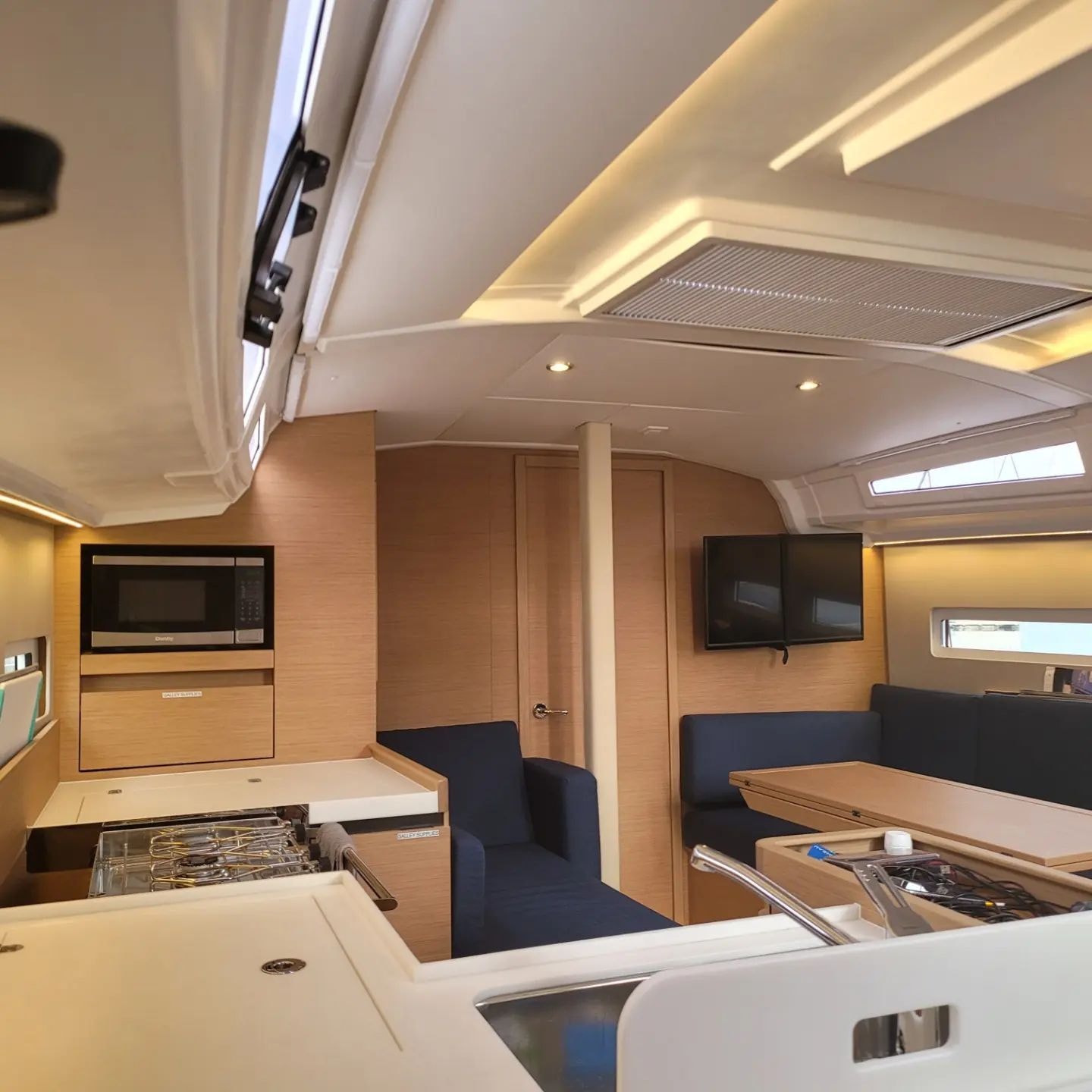 Rabbit Hole cabin interior — galley, saloon, and navigation station