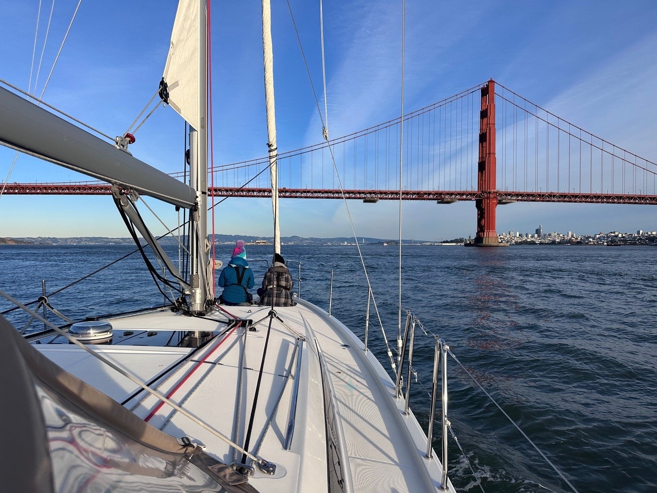 Cockpit view of the San Francisco waterfront at night with Ghirardelli Square lit up